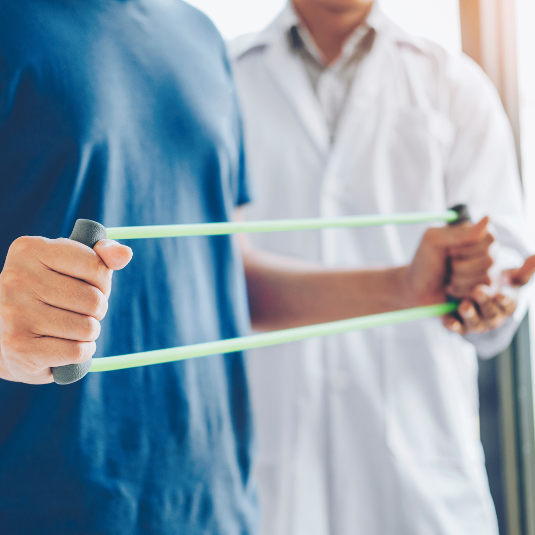 Man using resistance bands at physical therapy